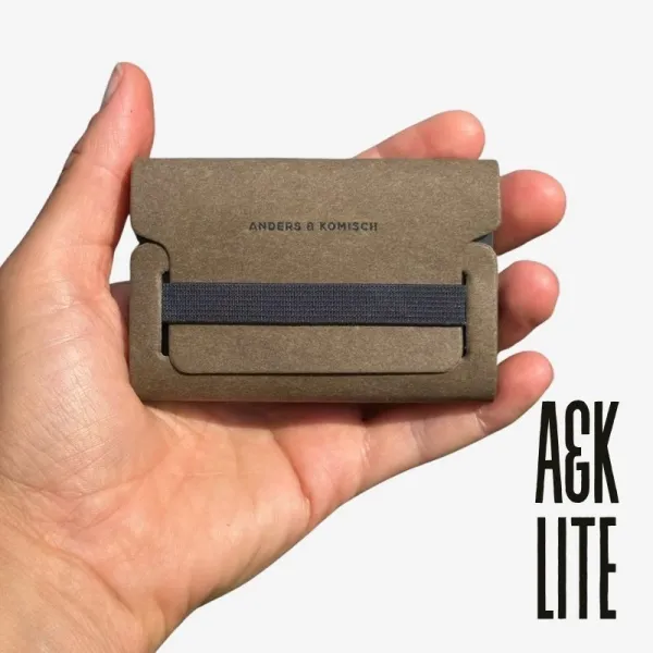 Woman holding the A&K LITE card holder — a lightweight, minimalist slim wallet.