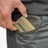 Man placing the A&K LITE card holder into the front pocket — ultra slim and compact.